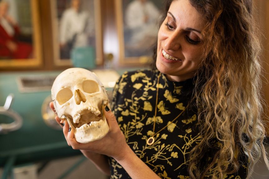 Donna Baluchi holding a human skull