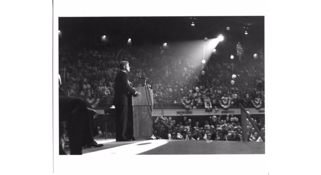 Candidate John F. Kennedy addressing an estimated crowd of 8,000 at Reynolds Coliseum, 1960.