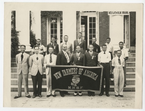 A Photograph of Unidentified NFA Student Members Holding a NFA Banner