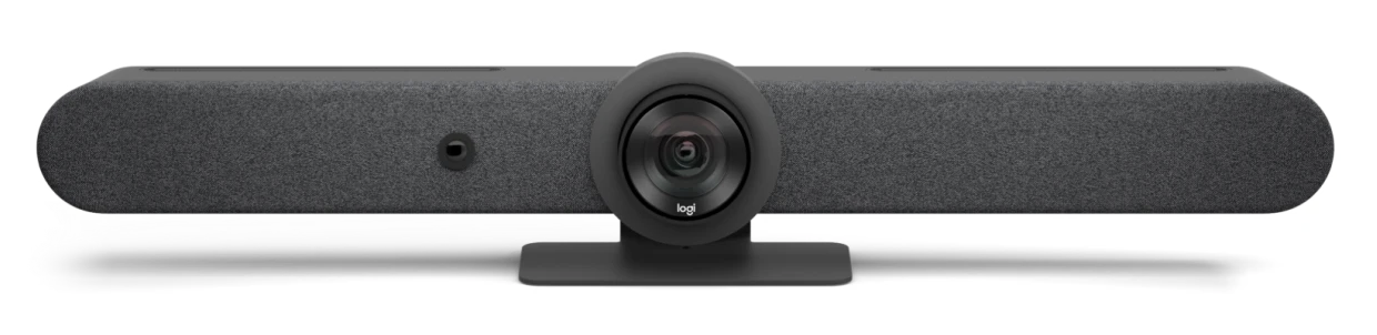 Camera lens centered in an oblong speaker bar with built in microphone and a short table-top stand.
